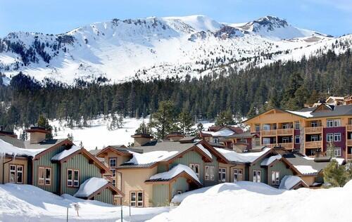 Condo units sit at the base of a snow covered Mammoth Mountain.