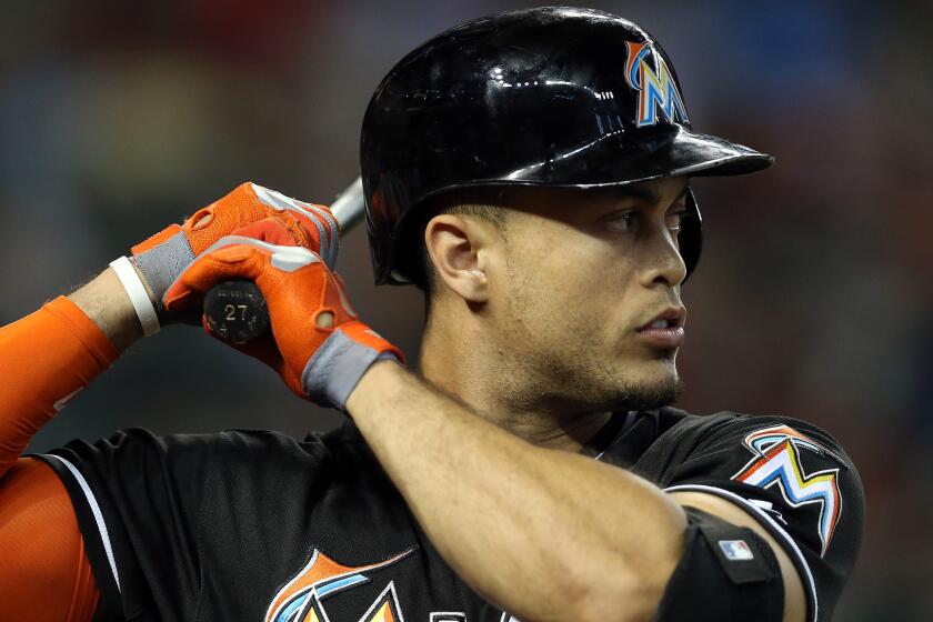 Marlins outfielder Giancarlo Stanton says he would be prepared to stay in Miami if the team is "prepared to win."