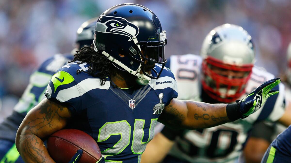 Seattle running back Marshawn Lynch carries the ball during the Seahawks' 28-24 loss to the New England Patriots in Super Bowl XLIX on Feb. 1.