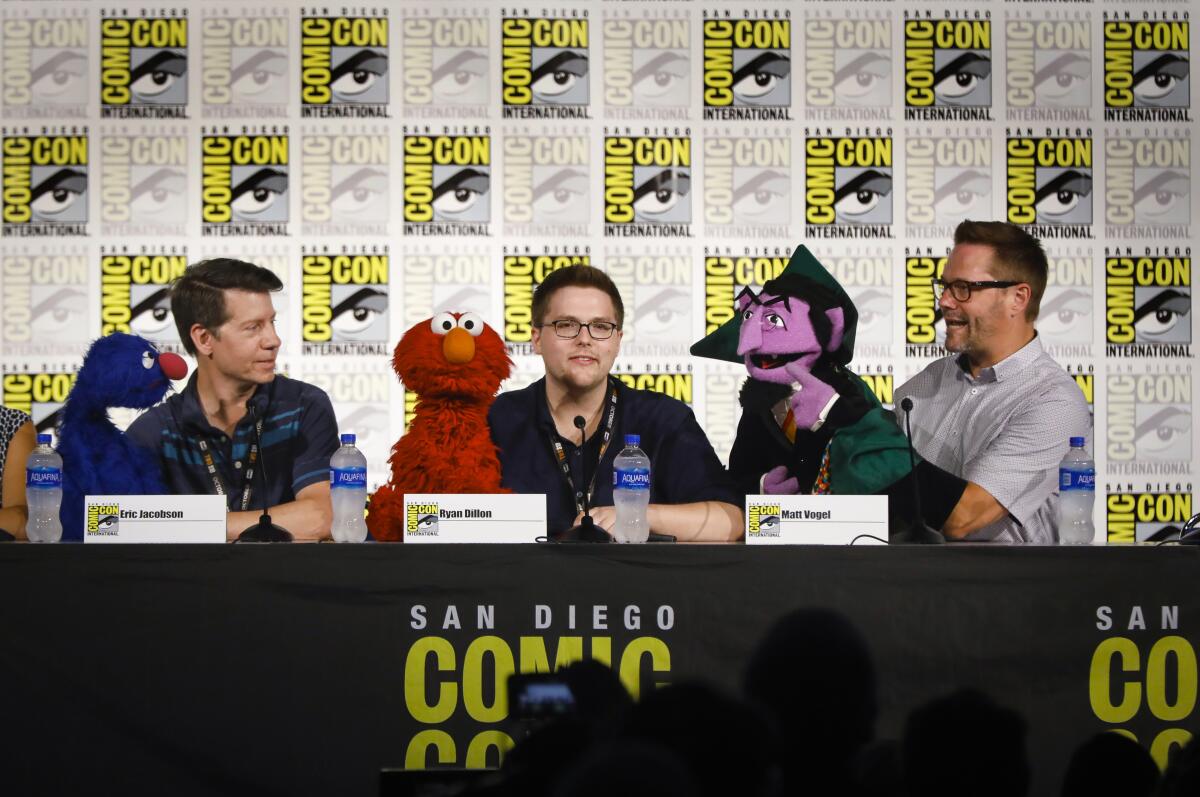 Sesame Street cast members, Eric Jacobson, left with Grover, Ryan Dillon, with Elmo, and Matt Vogel, right, who is the Count.