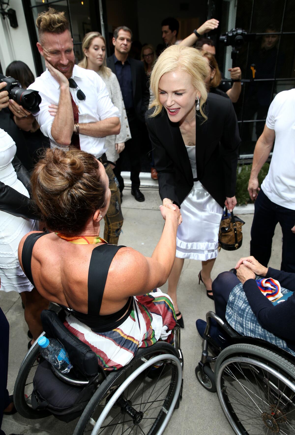 Paralympic champion Tatyana McFadden, winner of multiple gold medals, meets Nicole Kidman at Gold Meets Golden on Saturday.