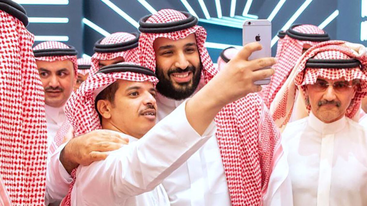 A picture provided by the Saudi Royal Palace on Tuesday shows Saudi Crown Prince Mohammed bin Salman, center, posing for a selfie during the Future Investment Initiative conference in the Saudi capital of Riyadh.