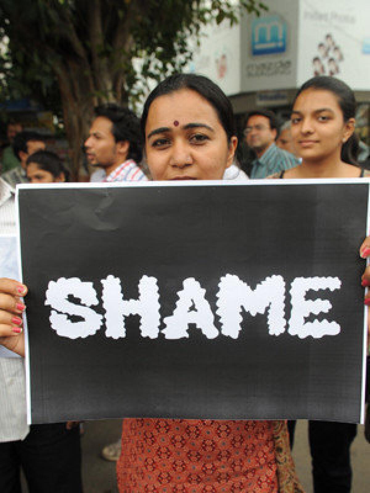 Indian journalists in Ahmedabad stage a protest Saturday against the gang rape of a female colleague in Mumbai.