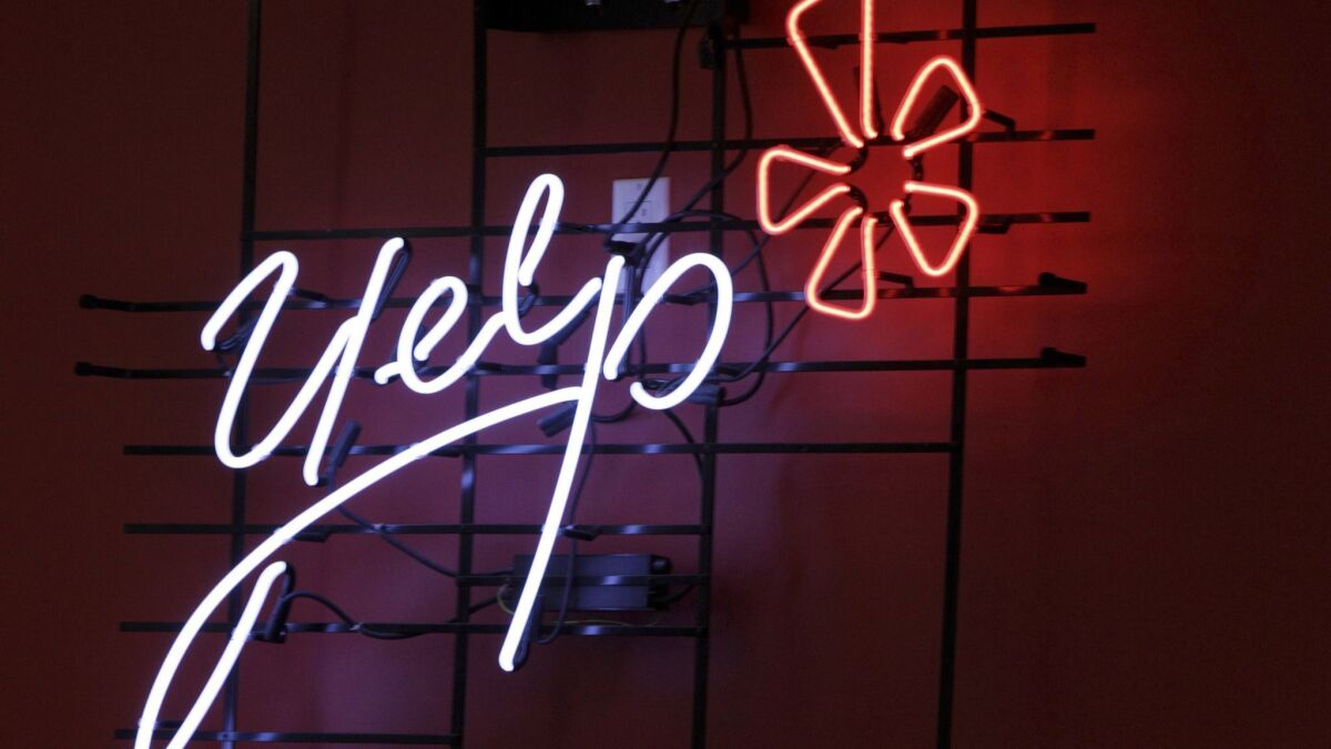 Yelp's logo, rendered in neon at its New York headquarters.