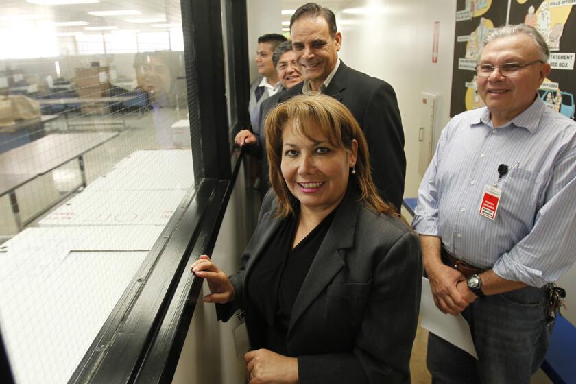 Patty Lopez with supporters at the ballot counting room last week.