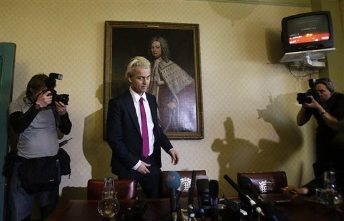 Controversial Dutch politician Geert Wilders arrives to take his seat at a press conference in London, Friday, March 5, 2010. Dozens of demonstrators gathered outside of Britain's Parliament on Friday, ahead of the viewing of an anti-Islam film by Dutch politician Geert Wilders, whose strong showing in a local elections sparked concern that his anti-immigrant views have become widely accepted in the Netherlands. (AP Photo/Matt Dunham)