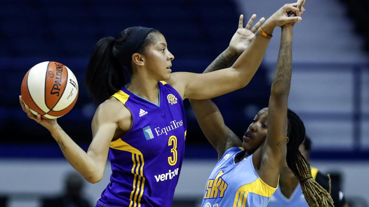 Sparks forward Candace Parker looks to pass over Sky guard Jamierra Faulkner during Game 4 on Tuesday night.