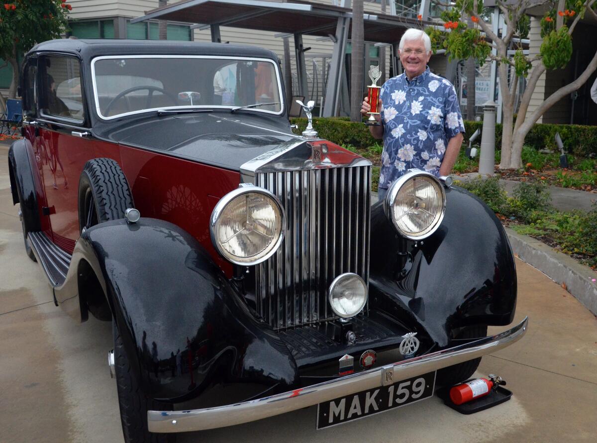 Robert Dryden won the People's Choice award with his 1936 Rolls Royce at the OASIS car show held Saturday.