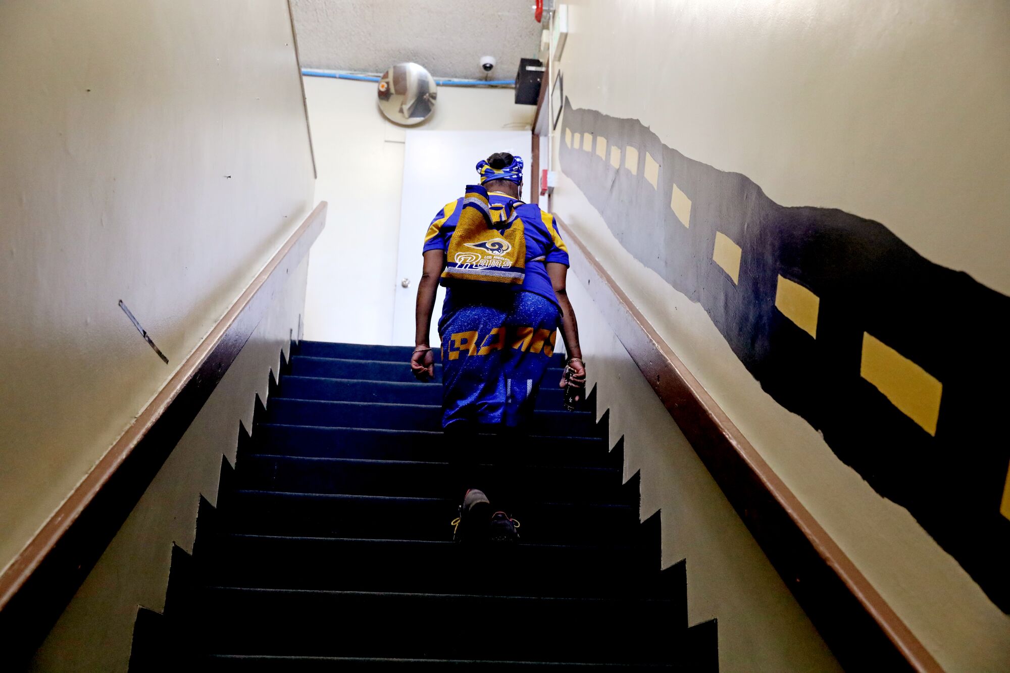 Latasha Bracks walks up stairs