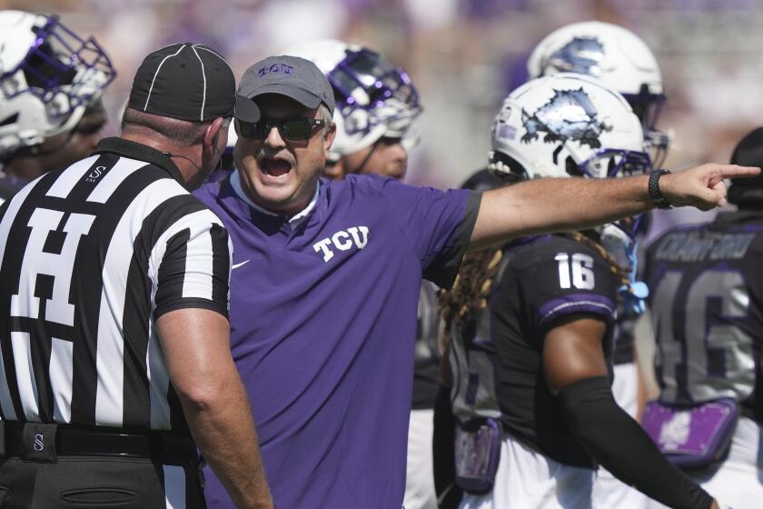 TCU head coach Sonny Dykes yells at an official during the first half of an NCAA college football game against SMU, Saturday, Sept. 23, 2023, in Fort Worth, Texas. (AP Photo/LM Otero)