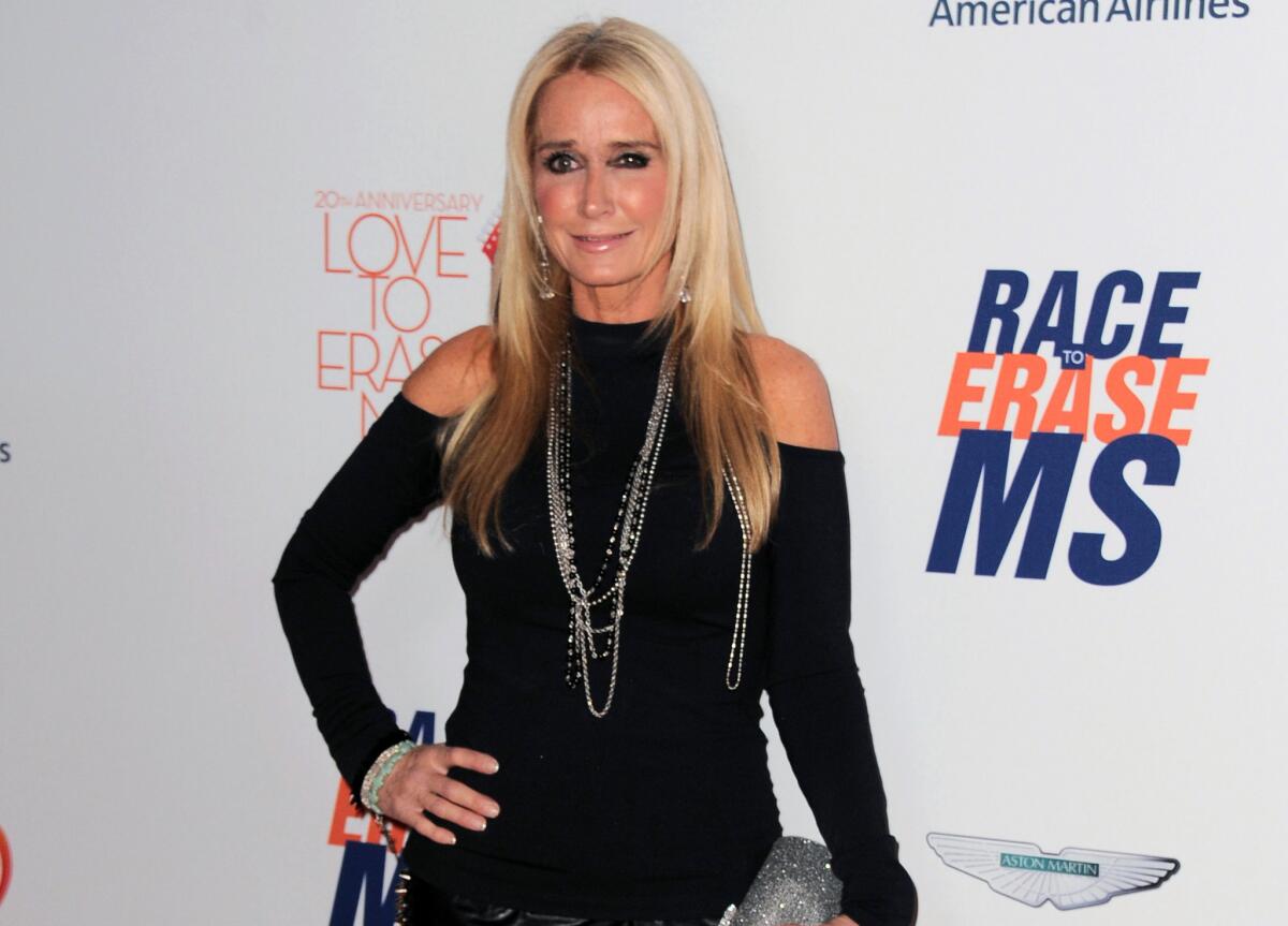In this May 3, 2013, file photo, Kim Richards arrives at the 20th annual Race to Erase MS event in Los Angeles.
