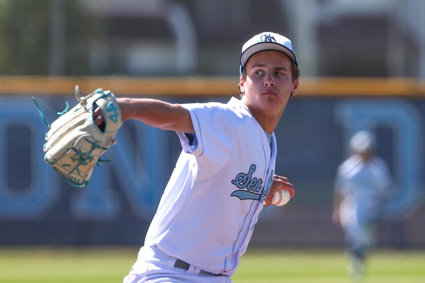 Starting pitcher Stevie Jones (14) of Corona del Mar throws during Battle of the Bay and Surf League game.