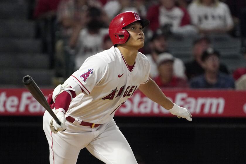 Los Angeles Angels' Shohei Ohtani runs to first as he flies out during the seventh inning of a baseball game against the Cleveland Guardians Monday, April 25, 2022, in Anaheim, Calif. (AP Photo/Mark J. Terrill)