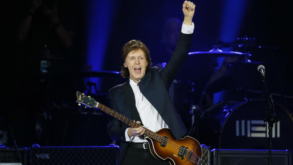 Paul McCartney performs in 2015 at the Stade de France in Saint-Denis near Paris.