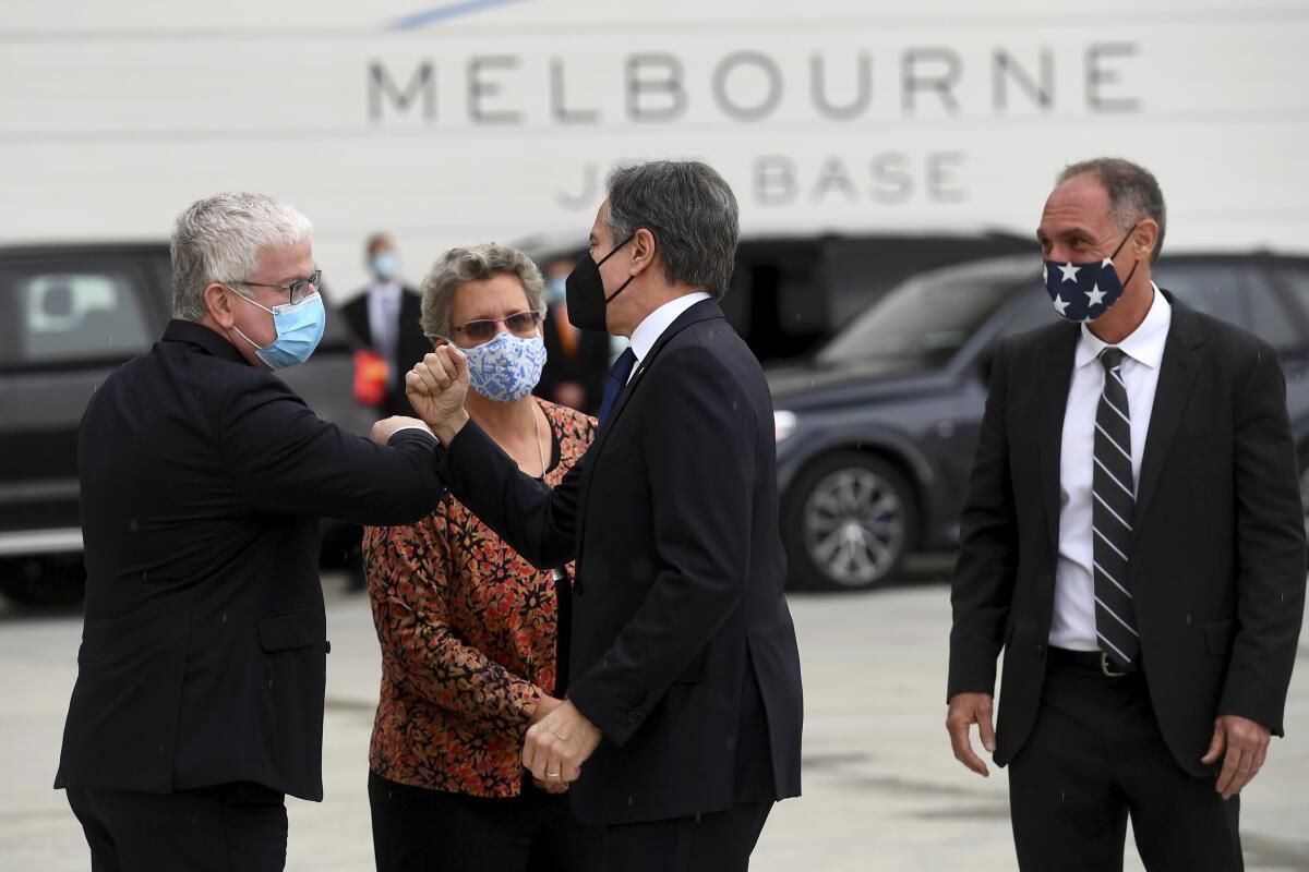 Secretary of State Antony J. Blinken being greeted by U.S. diplomat in Australia