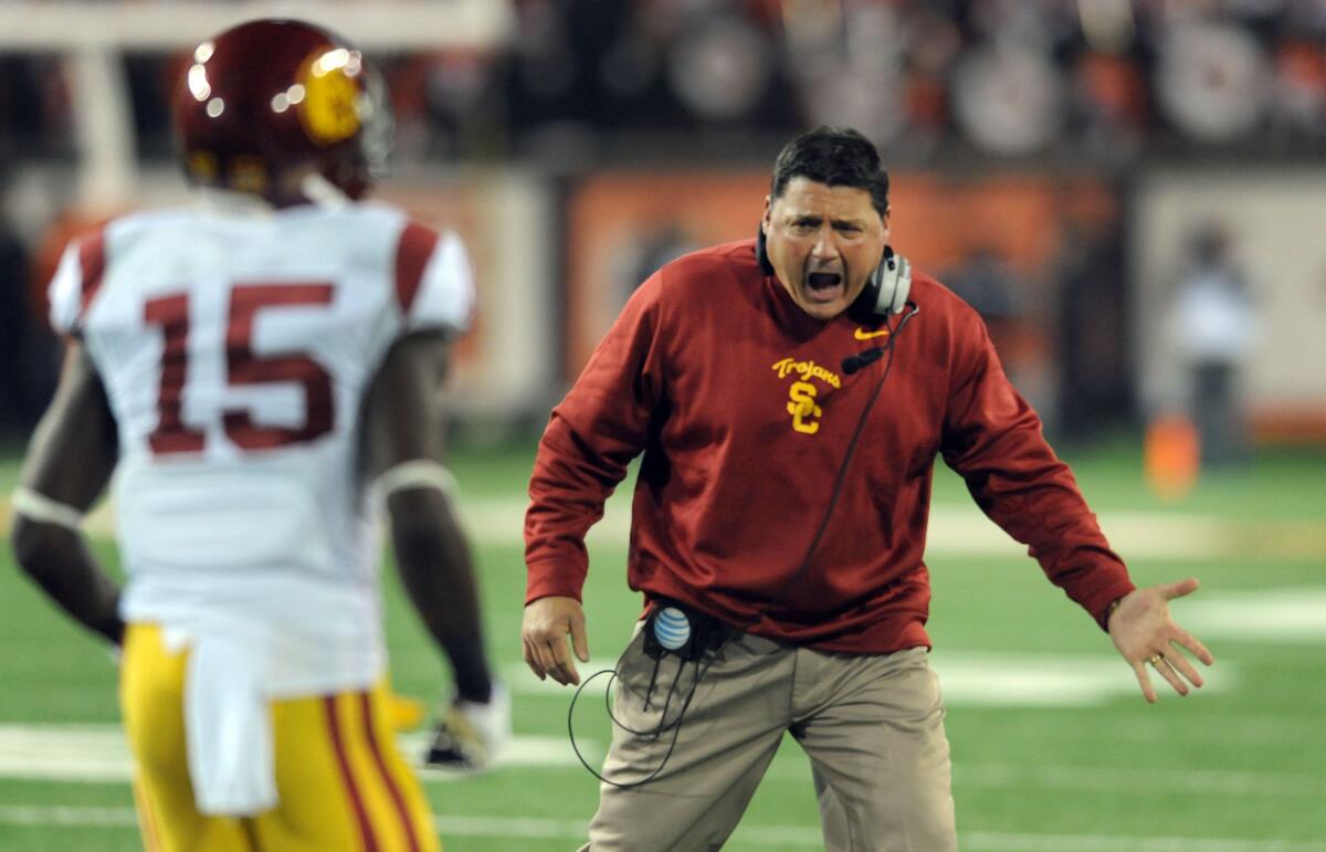 USC head coach Ed Orgeron celebrates with wide receiver Nelson Agholor.