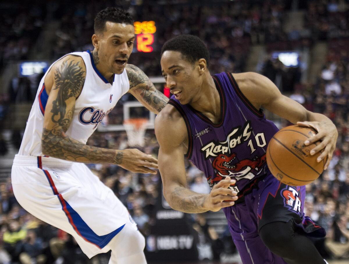 Clippers forward Matt Barnes tries to defend the drive of Raptors forward DeMar DeRozan. DeRozan finished with 24 points to lead Toronto to a 123-107 win.