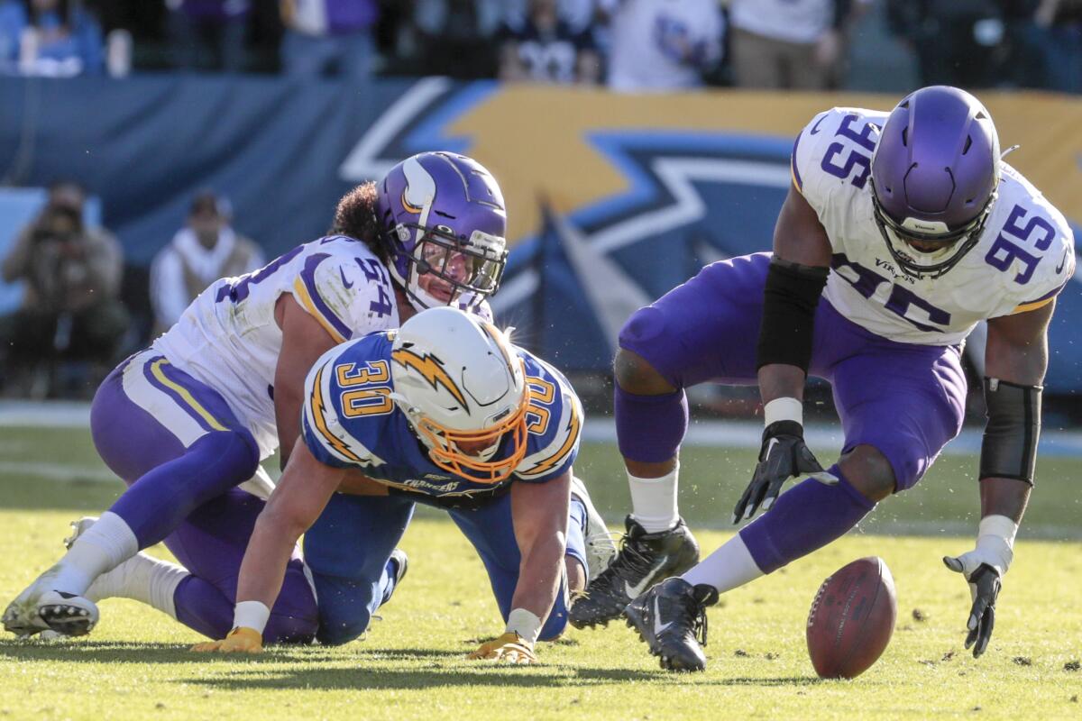 Vikings defensive end Ifeadi Odenigbo scoops up a fumble by Philip Rivers and returns it for a second-quarter touchdown Dec. 15.