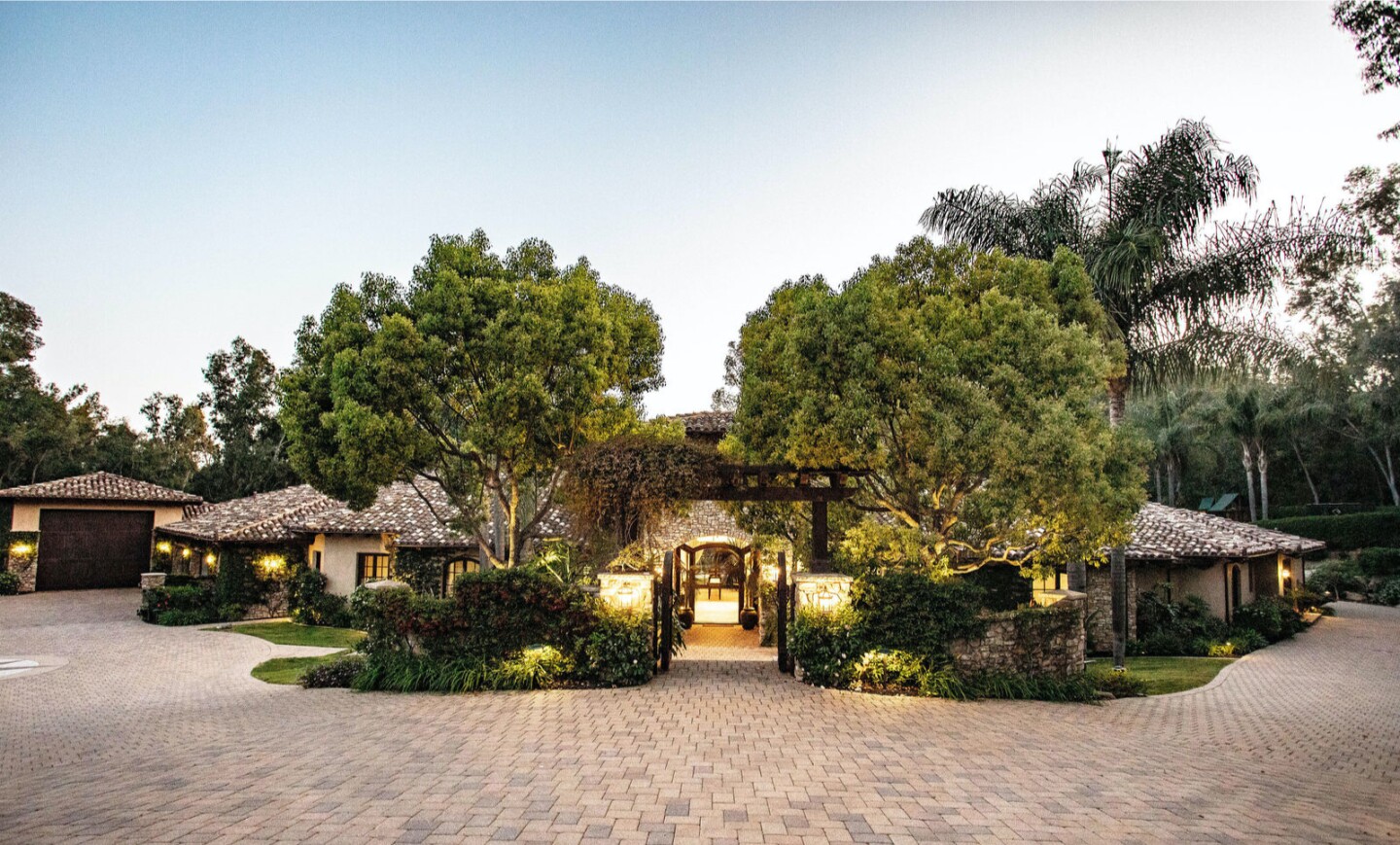 Spanning two acres in Fairbanks Ranch, the property holds a 10,000-square-foot home and a resort-style backyard.
