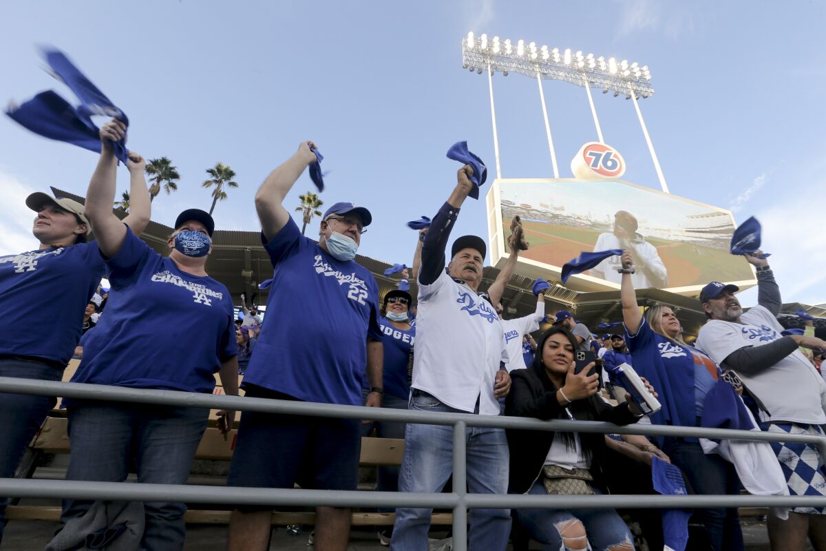 Dodgers fans wave their towels in the outfield pavilion.