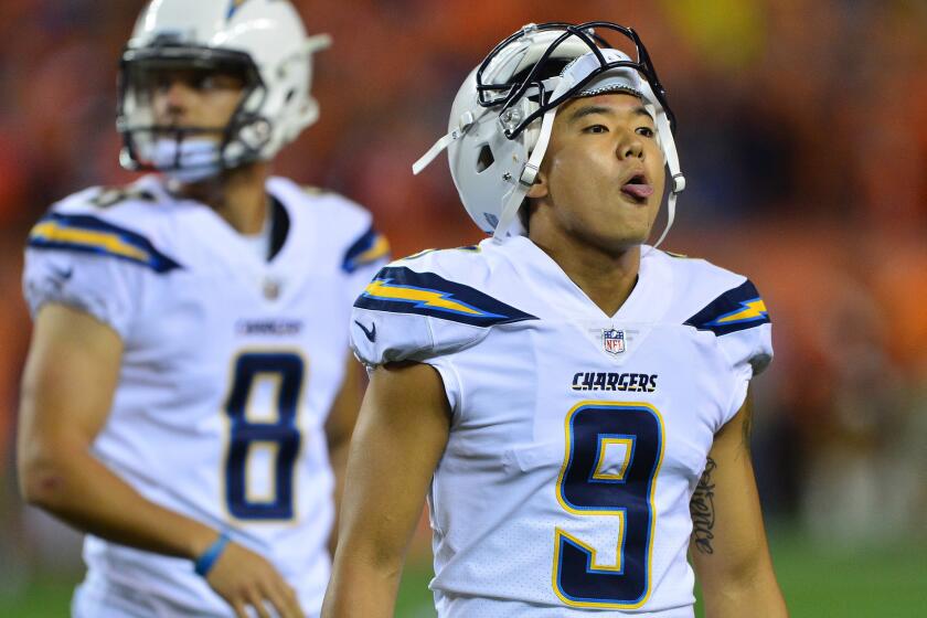 Chargers kicker Younghoe Koo reacts after his game-tying field goal attempt at the end of regulation was blocked by the Denver Broncos on Sept. 11.