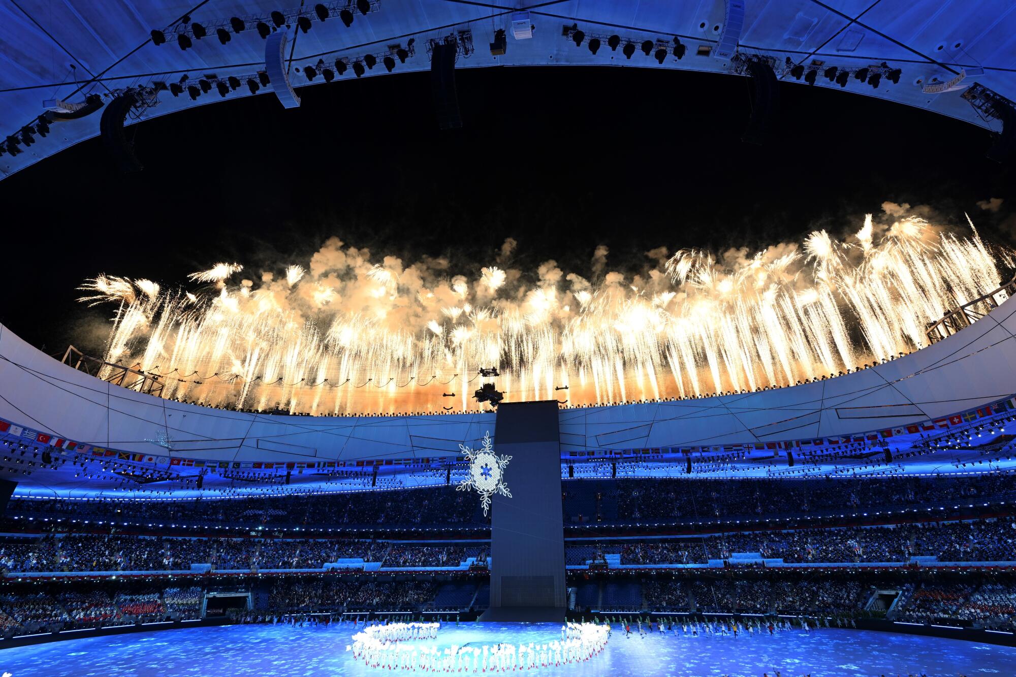 Fireworks light up the sky above National Stadium, known as Bird's Nest, during the opening ceremony.