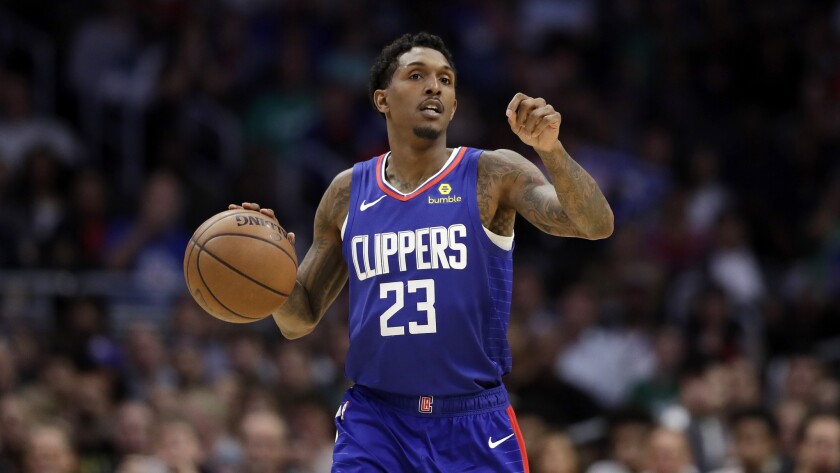 Clippers guard Lou Williams brings the ball up court and initiates the offense.