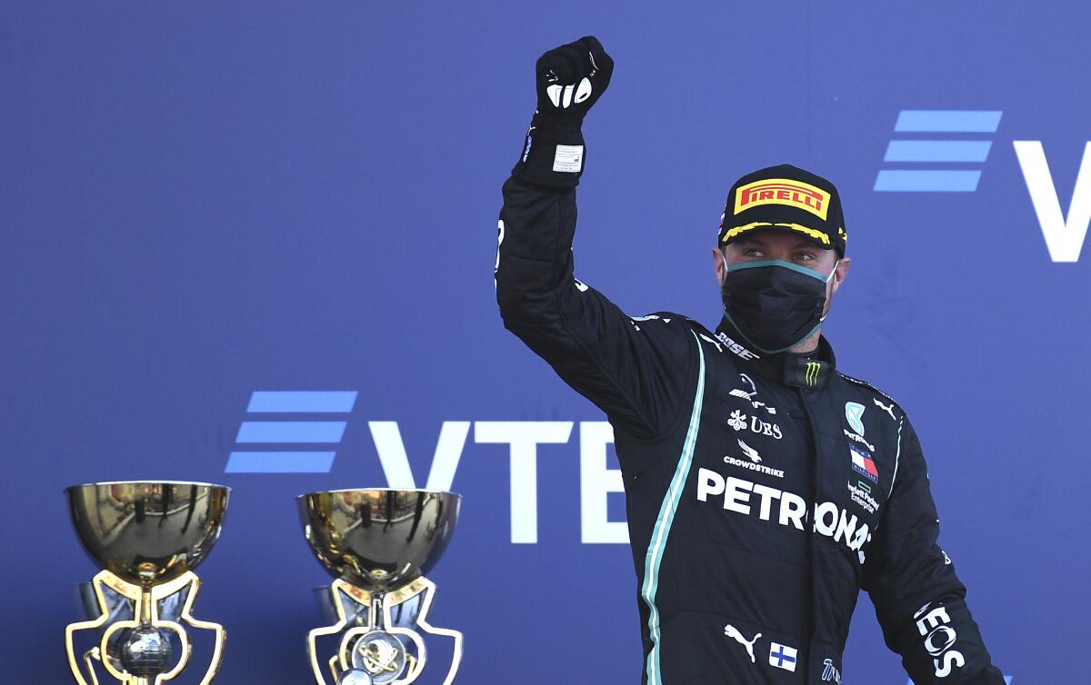 Valtteri Bottas celebrates on the podium.