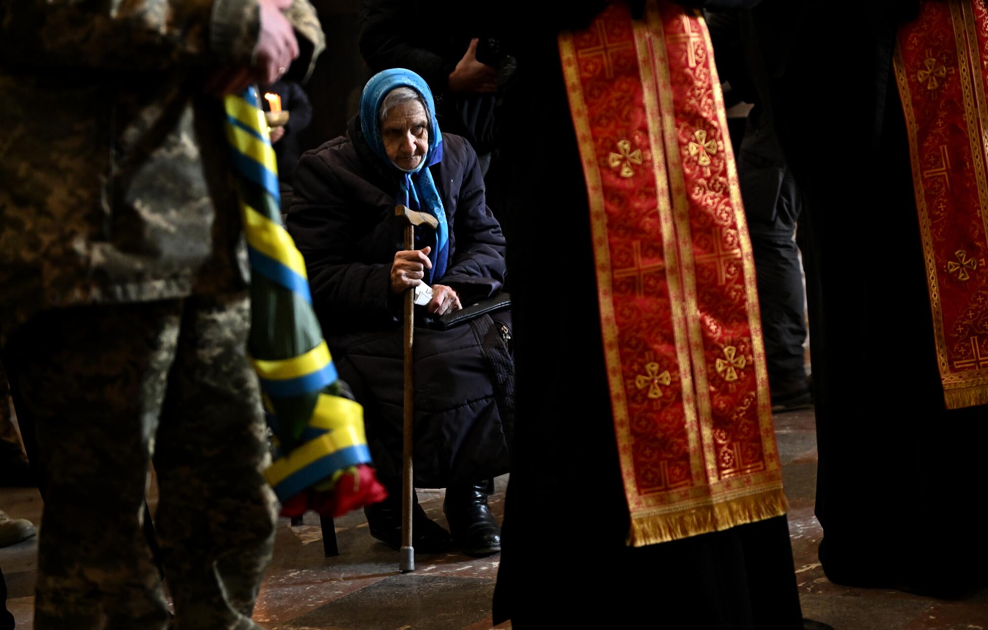 A woman pays her respects during a funeral service for Ukrainian soldier Ivan Skrypnyk in Lviv on Thursday.