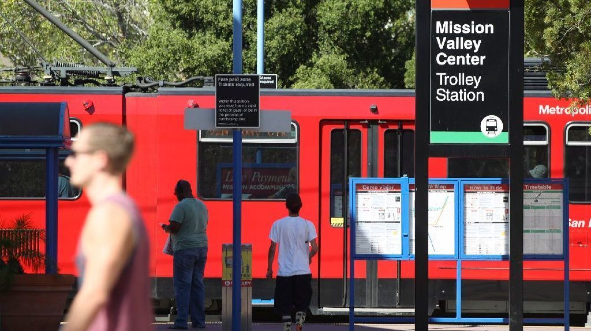 The San Diego Trolley arrives at the Mission Valley Center Trolley Station.