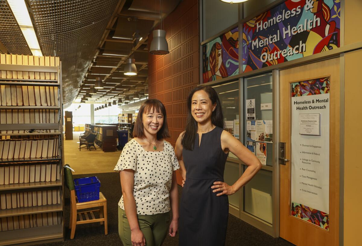 Supervising librarian Monnee Tong and SDSU professor Lianne Urada at San Diego Central Library.