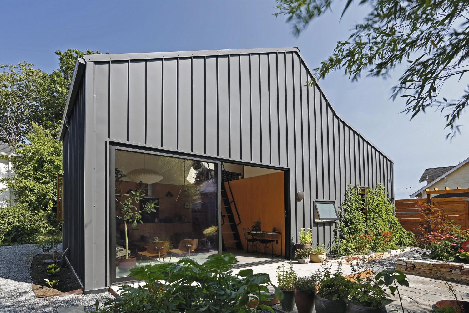 This image provided by Bigger Than Tiny, Smaller Than Average, is an example of an Accessory Dwelling Unit, a small home separate from a main house. Proponents say ADUs are a low-impact, energy-efficient way to create more living space. (Mark Woods Photography for Bigger Than Tiny, Smaller Than Average via AP)