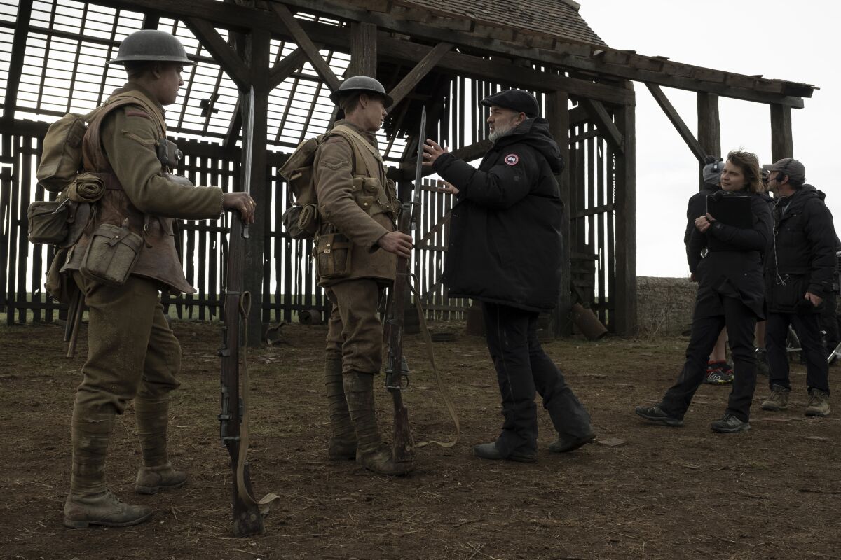 Dean-Charles Chapman, George MacKay and Sam Mendes on the set of “1917.”
