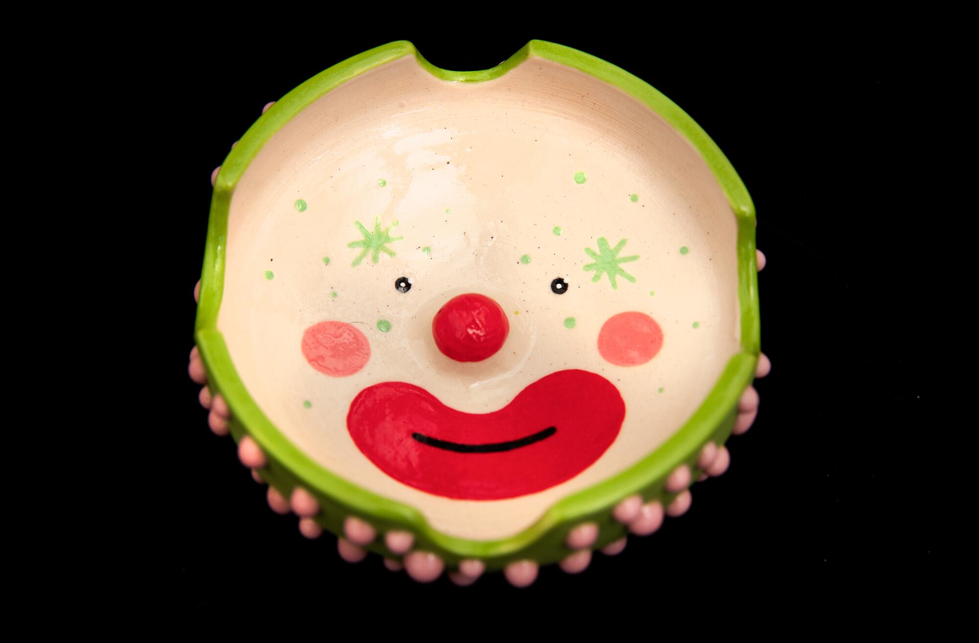 A ceramic clown ashtray.