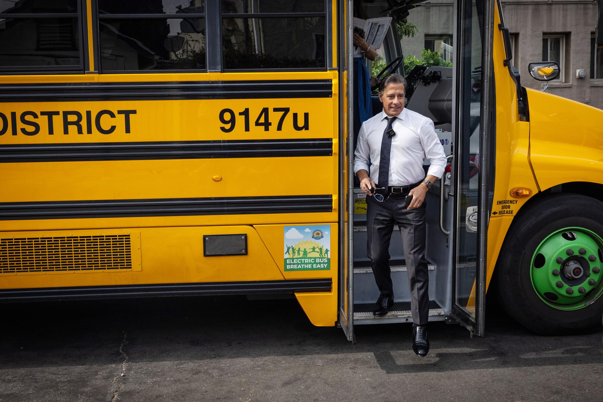  LAUSD Supt. Alberto Carvalho steps out of a school bus.