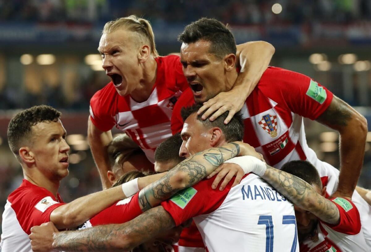 Croatia players celebrate after Luka Modric scored on a penalty kick against Nigeria on Saturday.
