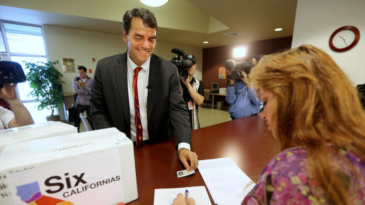 Tim Draper, seen here in 2014 submitting signatures on his plan to split California into six separate states. The measure failed to qualify for the ballot.