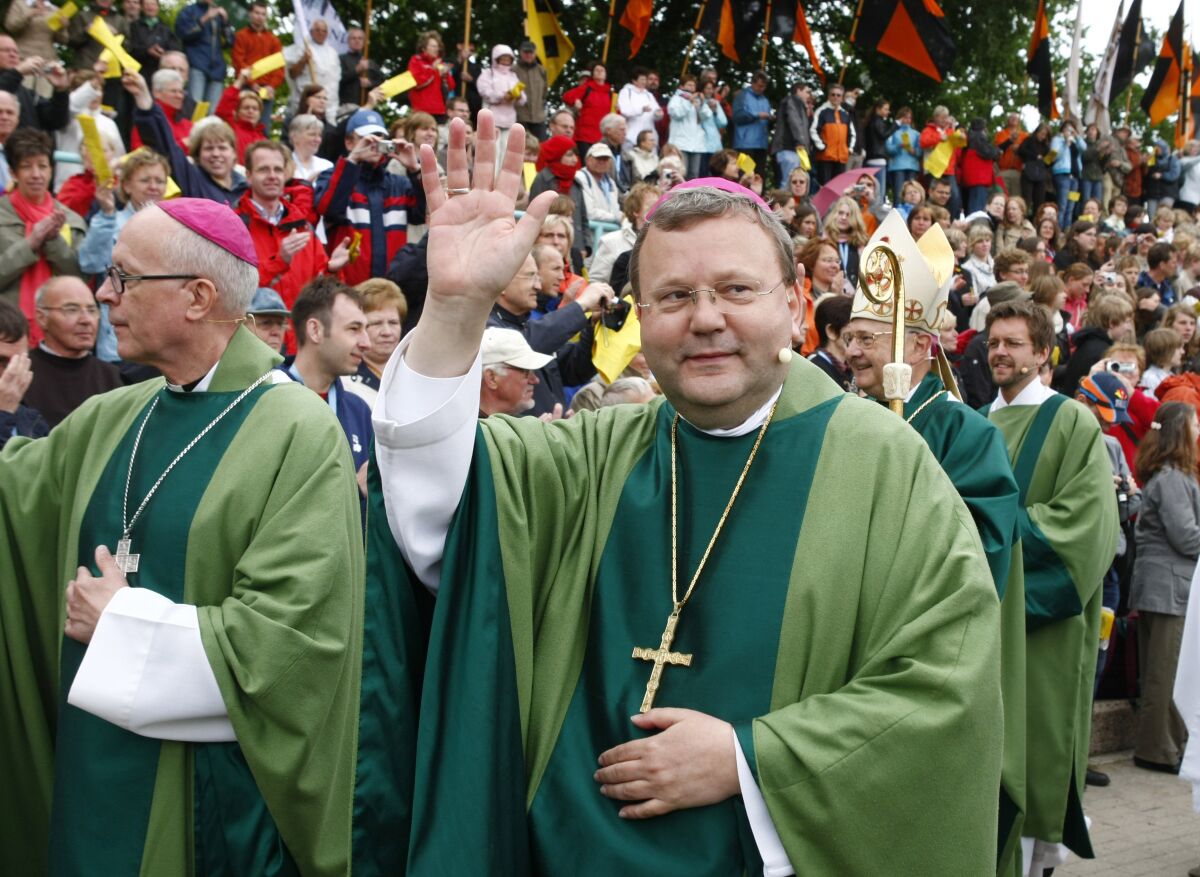 FILE - In this May 25, 2008, file photo, Bishop Franz-Josef Bode waves during the closing service of the 97th German Catholics Day in Osnabrueck, northern Germany. Pope Francis on Saturday, March 25, 2023 accepted a resignation request from a German bishop who asked to step down because of his mistakes in handling sexual abuse cases. Franz-Josef Bode became the bishop of Osnabrueck, Germany, in 1995. (AP Photo/Joerg Sarbach, File)