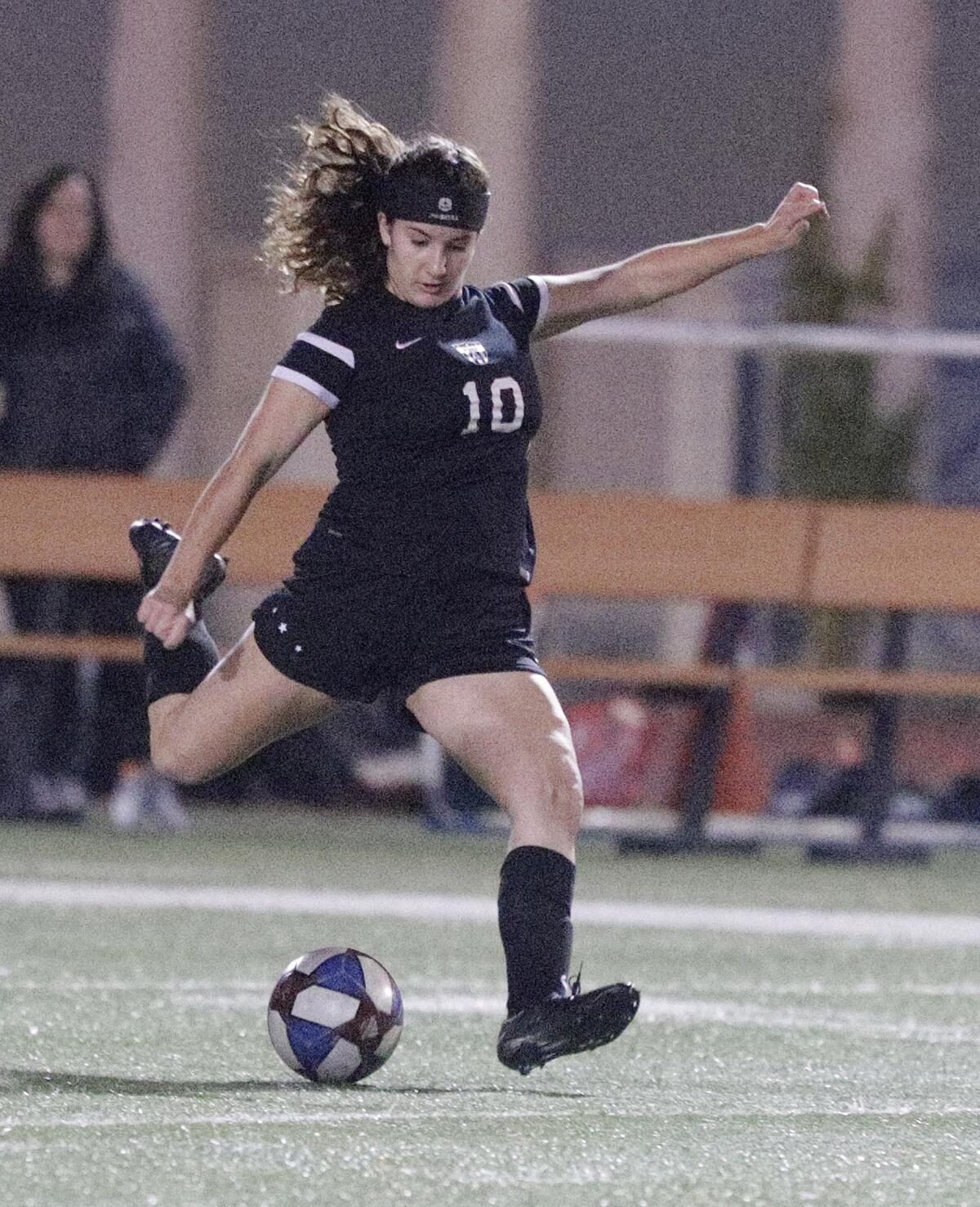 Flintridge Sacred Heart's Helena Locateli takes a thirty-five yard shot that skips and nearly scores against Sherman Oaks Notre Dame in the first half in a Mission League girls' soccer game at Occidental College in Los Angeles on Wednesday, January 8, 2020.