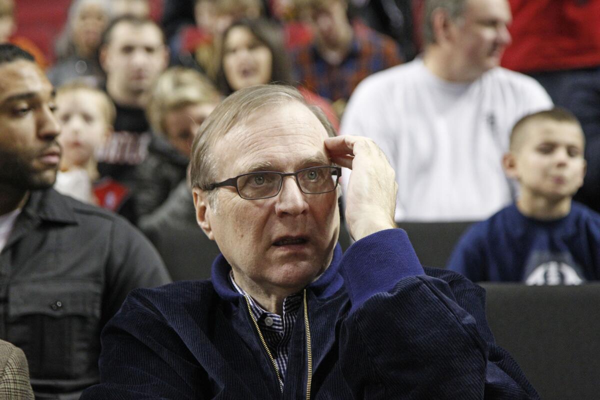 Paul Allen at a basketball game in 2011. The Microsoft founder's Seattle art space may soon be closing.