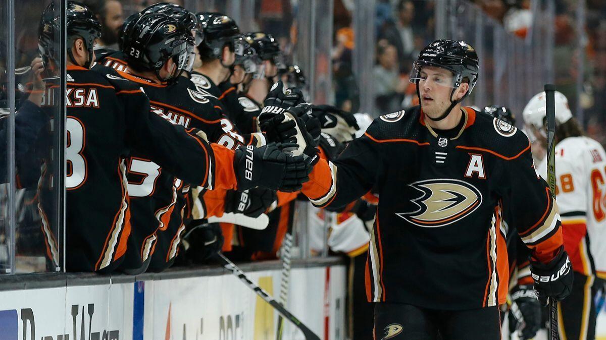 Ducks defenseman Cam Fowler, right, celebrates with teammates after scoring against the Calgary Flames on Dec. 29.