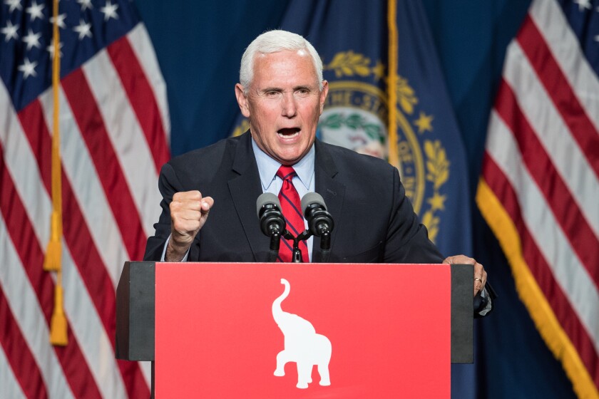 Former Vice President Mike Pence speaks at a lectern.