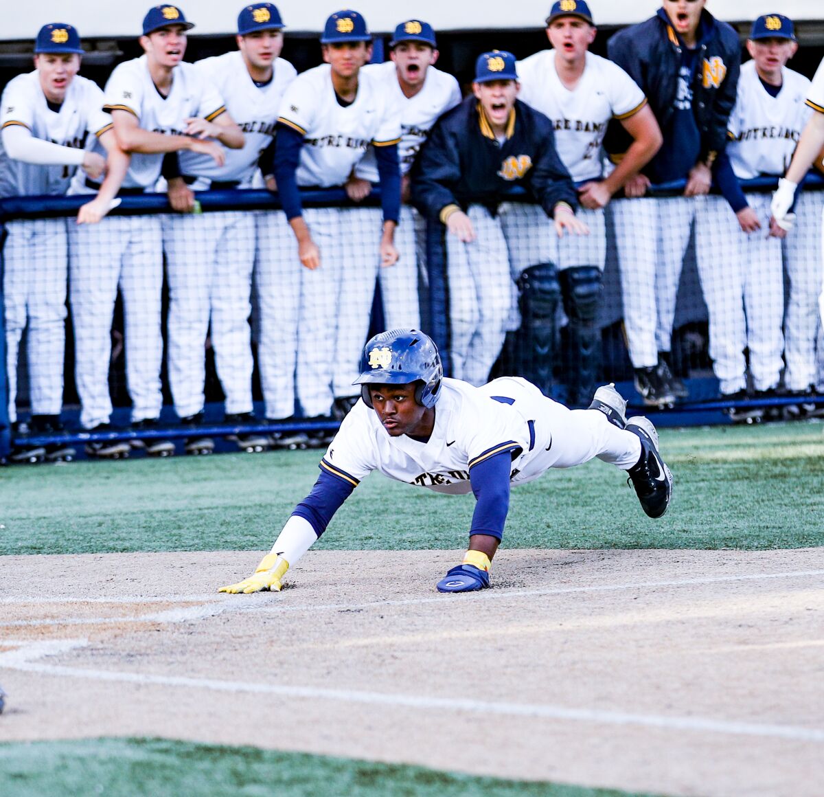 Dean West of Sherman Oaks Notre Dame slides safely into home in the first inning against Harvard-Westlake.