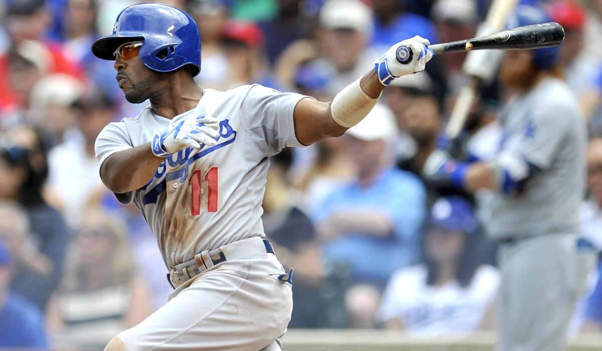 Los Angeles Dodgers' Jimmy Rollins hits a RBI single during the second inning against the Chicago Cubs on Thursday. Dodgers won 4-0.