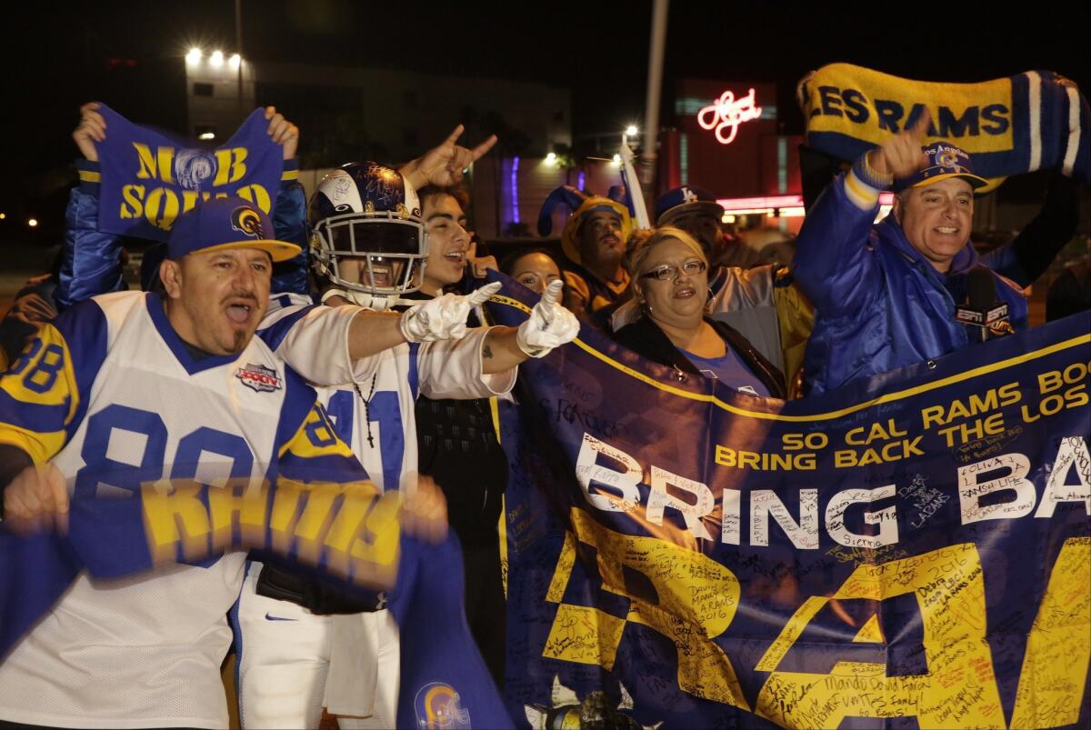 Football fans cheer for the return of the Rams to Los Angeles on the site of the old Hollywood Park racetrack in Inglewood on Jan. 12.