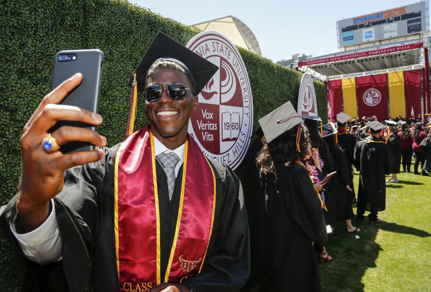 Gyasi Zardes snaps a selfie of himself while waiting with other graduates at Cal State Dominguez Hills' commencement ceremony at StubHub Center, where he stars for the L.A. Galaxy.