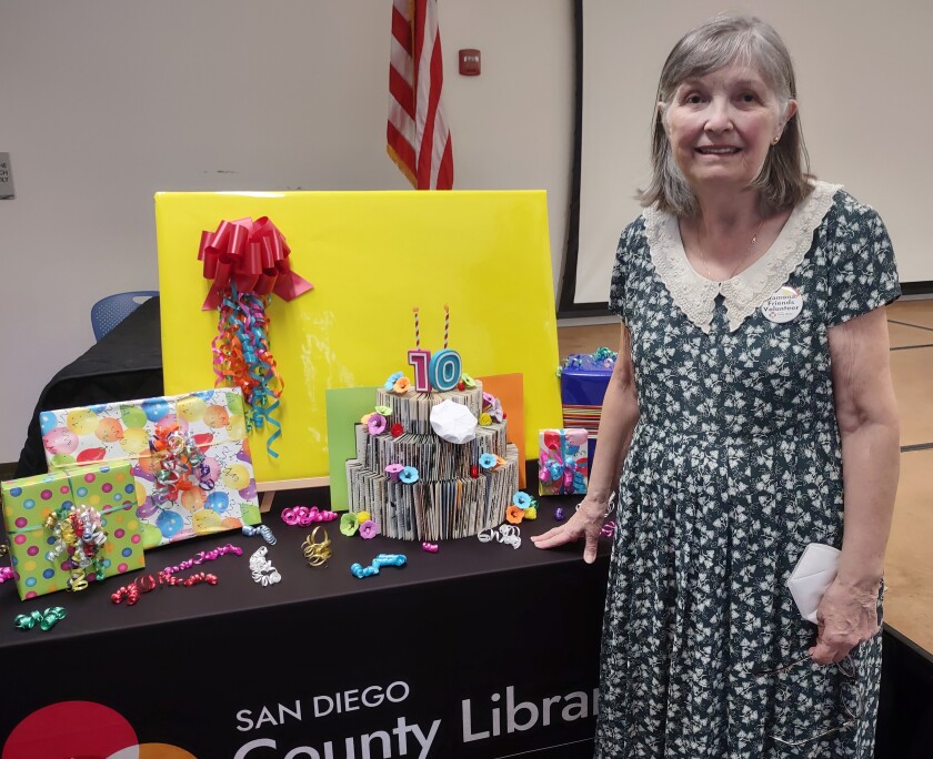 Friends of the Ramona Library President Maxine McNamara welcomes visitors to the library’s 10th anniversary event Feb. 12.
