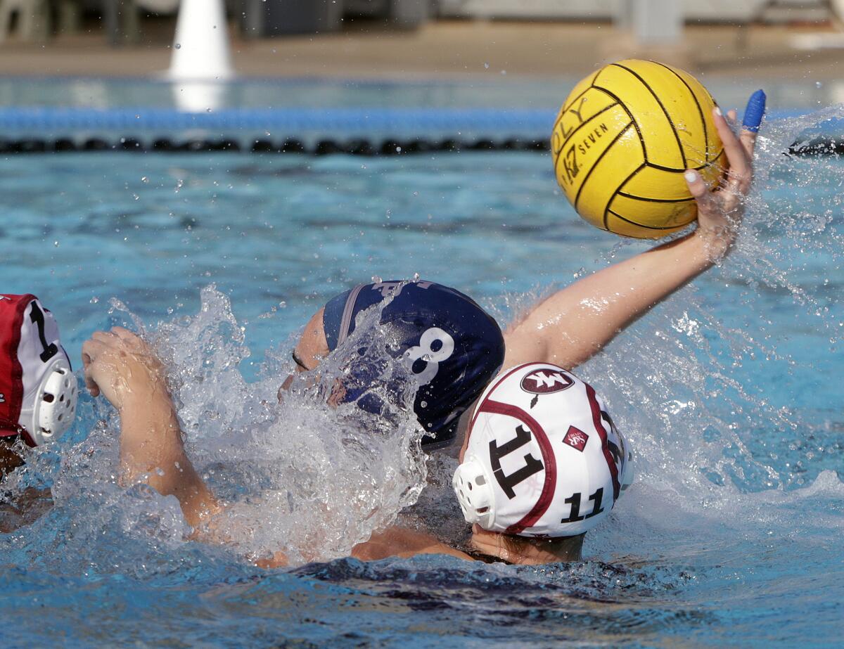 Flintridge Prep's Natalie Kaplanyan takes a rebound off of the Mark Keppel goalie to shoot it back and score in the CIF Southern Section Division VI semifinal girls' water polo playoff at Polytechnic School in Pasadena on Wednesday, February 19, 2020.