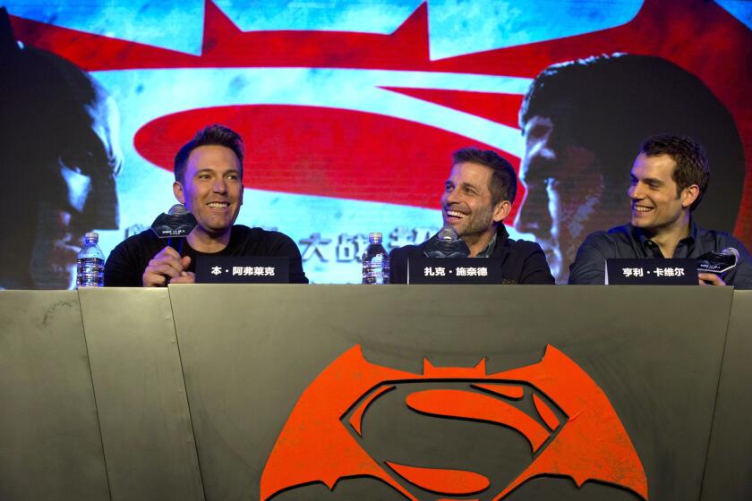 From left, actor Ben Affleck, director Zack Snyder and actor Henry Cavill take part in a press conference for the movie "Batman v Superman: Dawn of Justice" in Beijing on March 11.