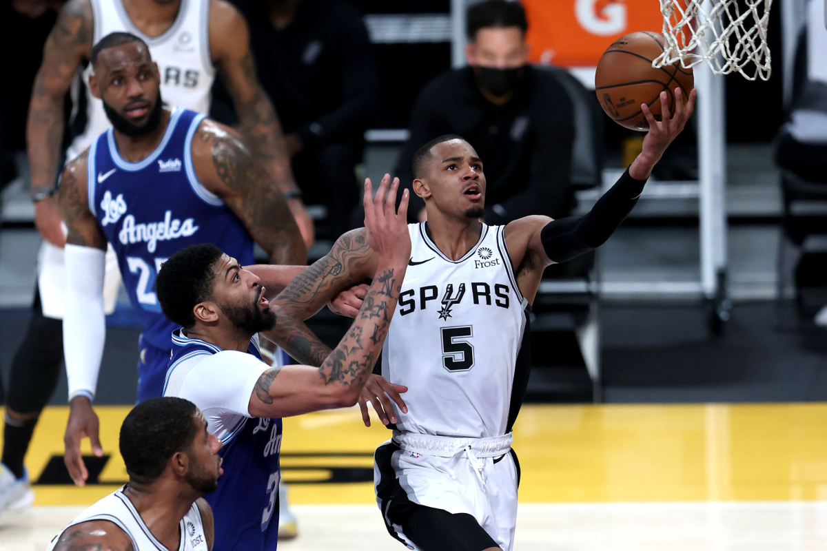 San Antonio's Dejounte Murray puts up a shot in front of Lakers forward Anthony Davis during the Lakers' loss on Thursday.